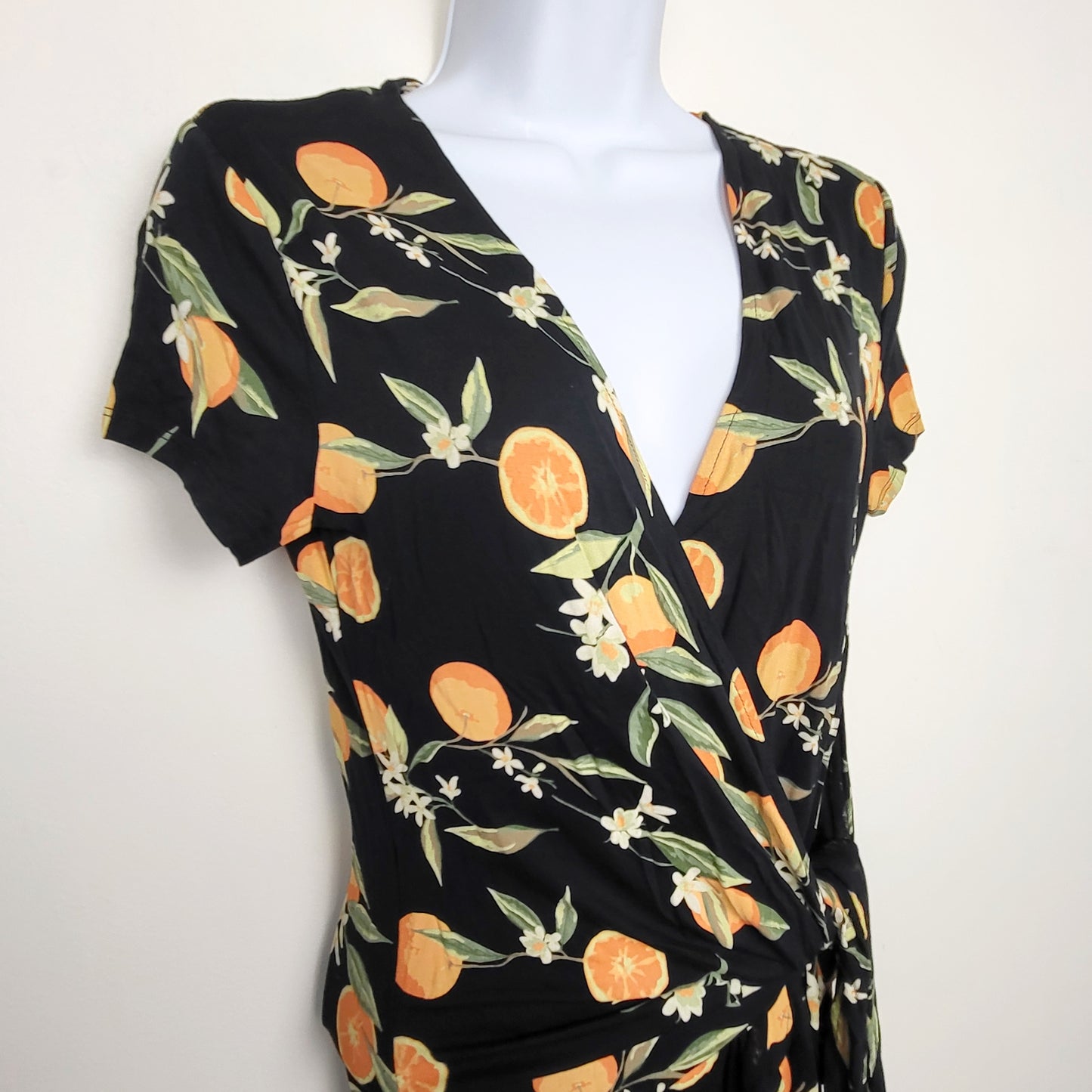 KTRC1 - Kismet black rayon orange printed wrap top. Size XS